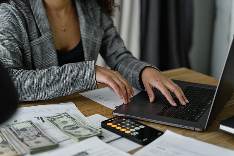 woman counting money and budgeting