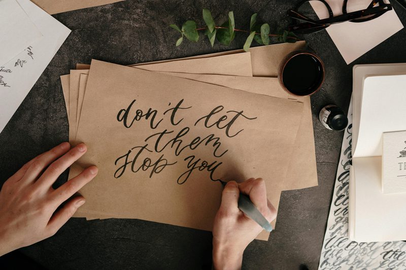 person practicing calligraphy