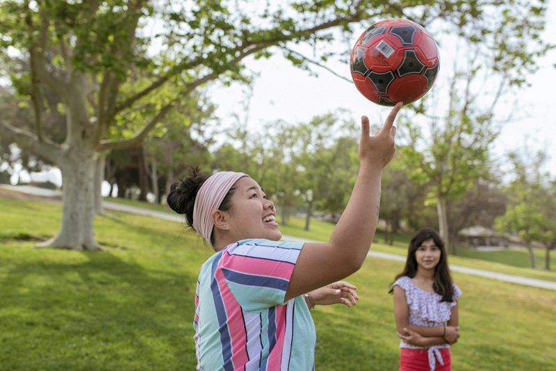 camp counselor spinning basketball on finger