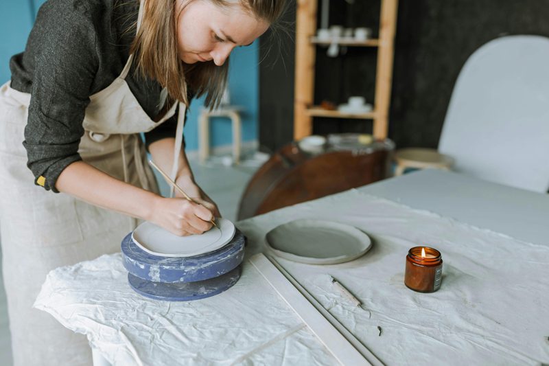 woman making pottery in studio