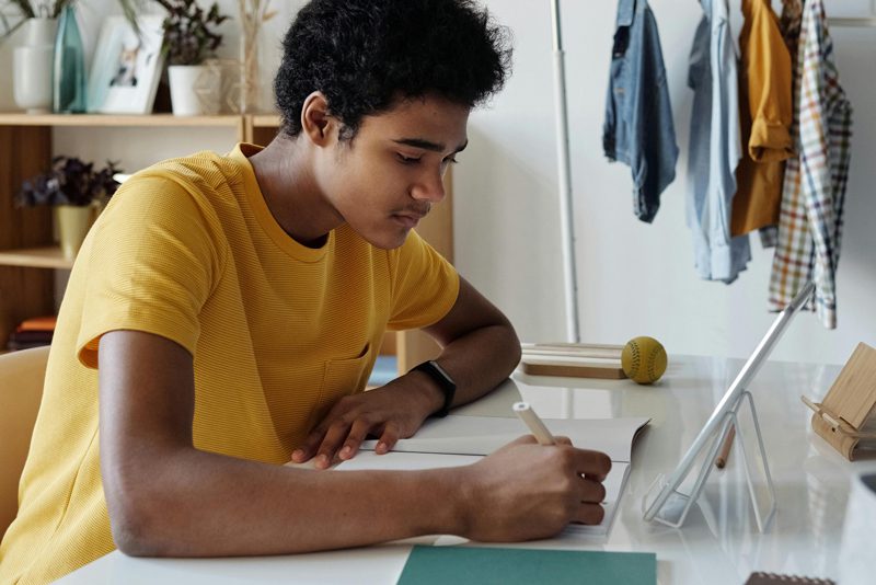 teen writing a business plan