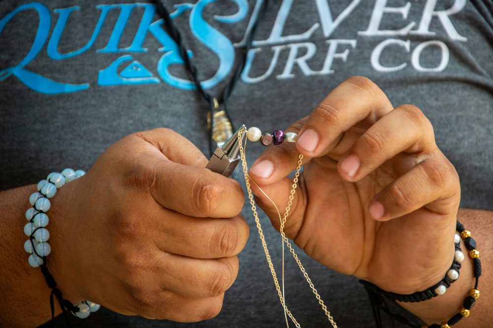 person creating handmade jewelry