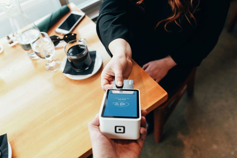 person paying with a credit card