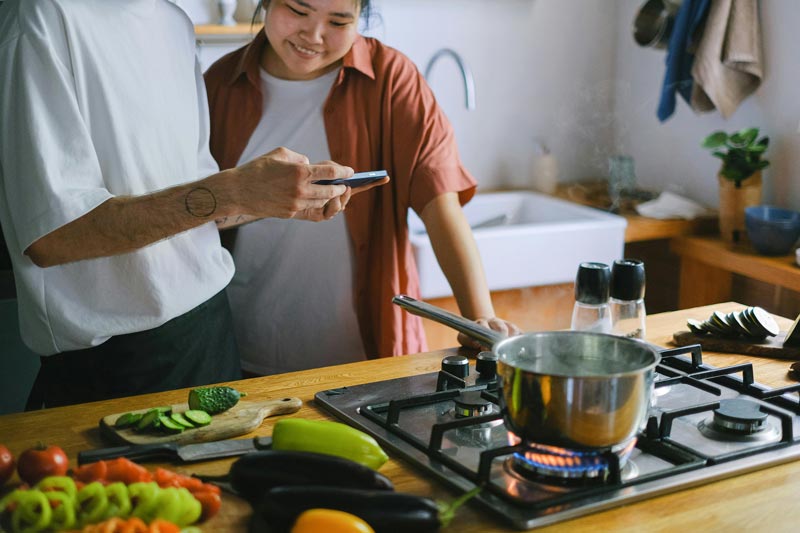 couple cooking together in the kitchen